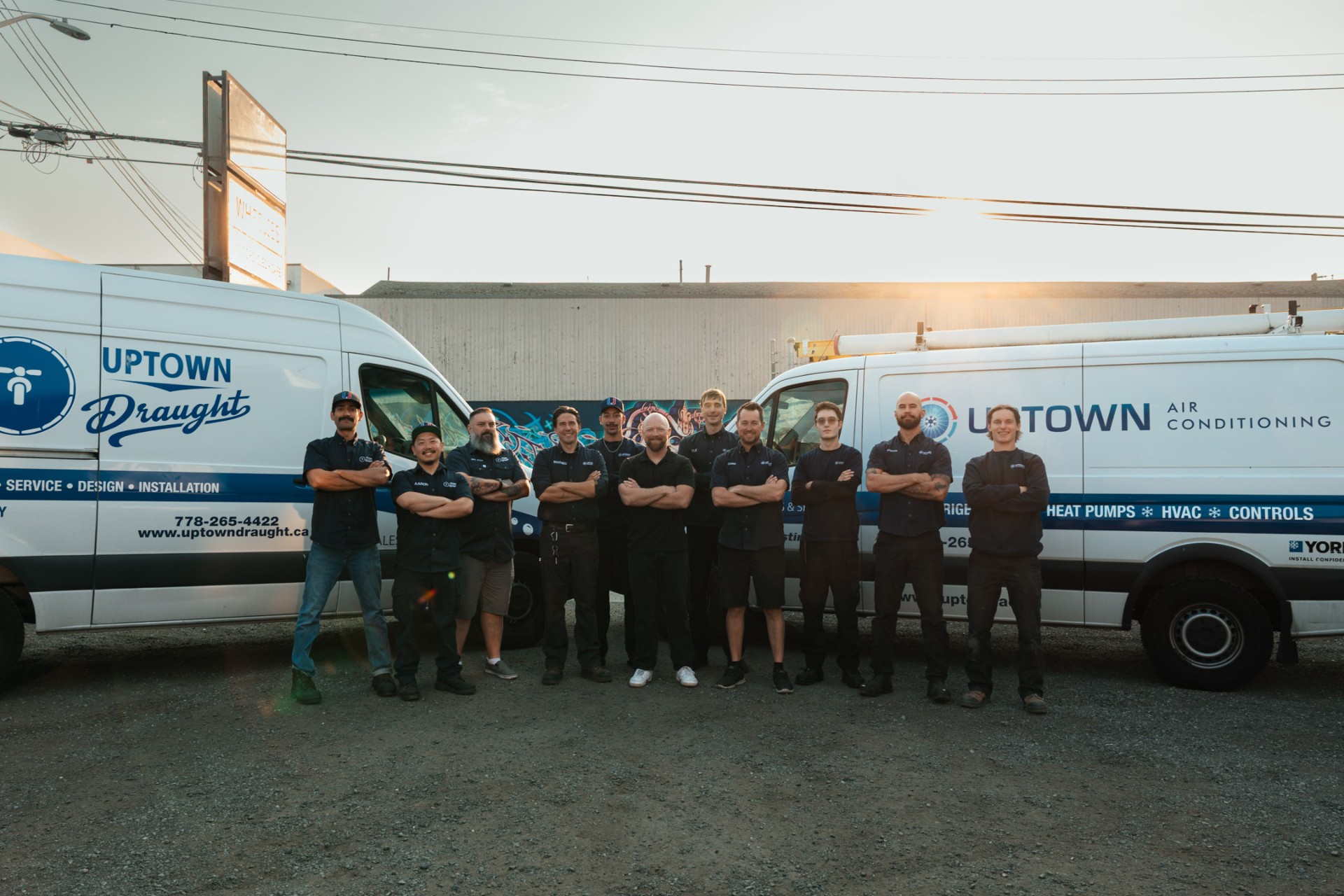Uptown Draught team standing in front of company vans